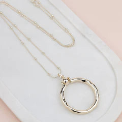 Gold Ring with Ball Necklace**